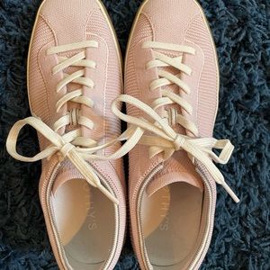 Pale pink Rothy’s lace-up sneakers